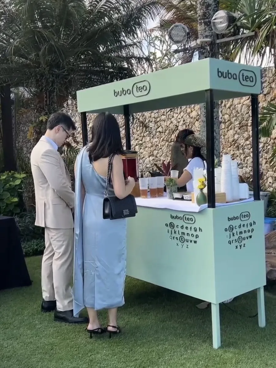 Guests being served at the Buba Tea cart during an event